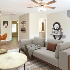 The essence of exceptional living a living room with a couch and a fan
