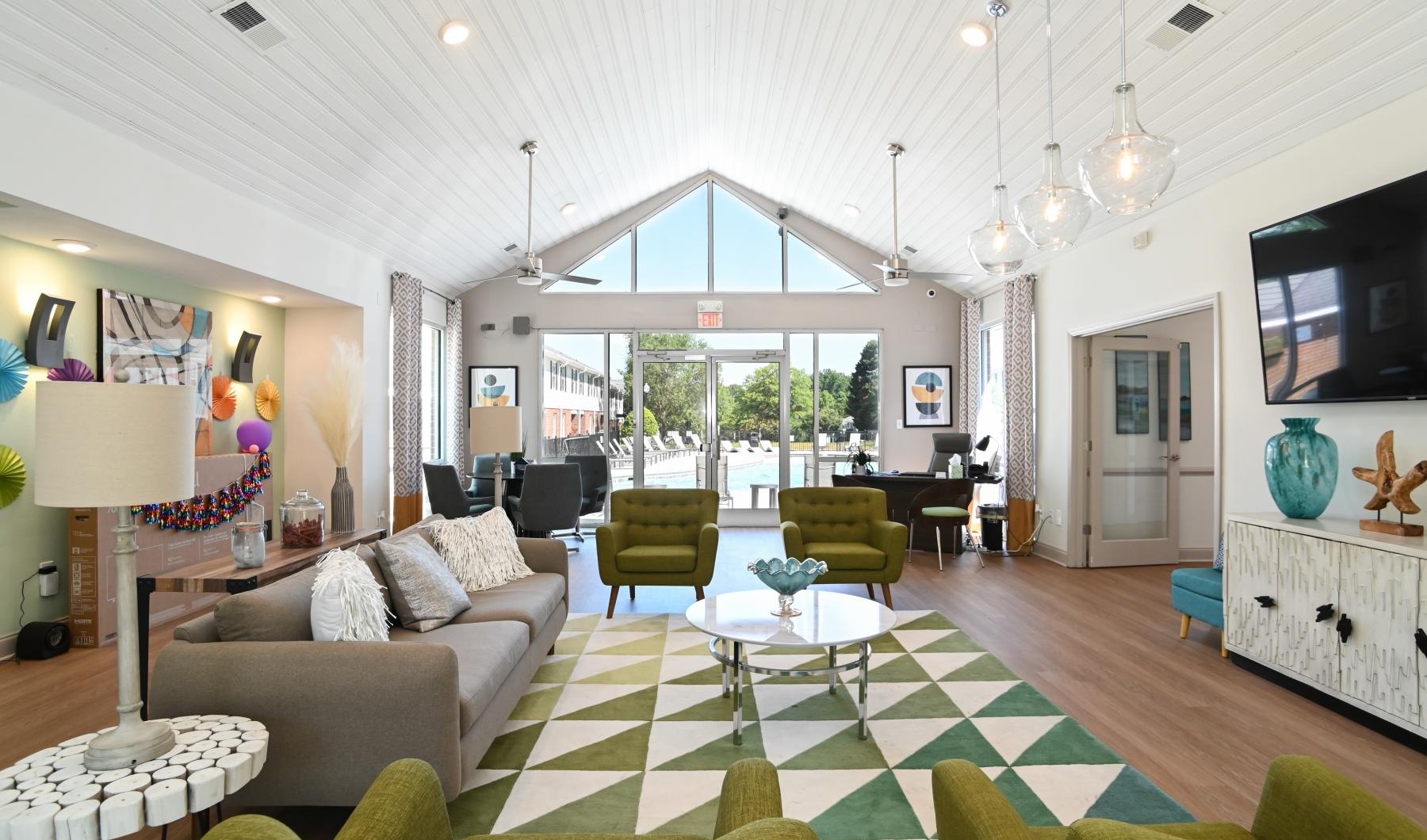 Settle into comfort at University Townhomes at Charlotte a club room with a large window