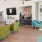 a living room with green chairs